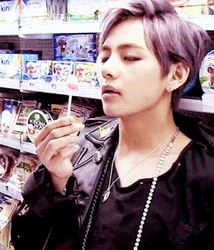V Licking His Lollipop Slowly GIF