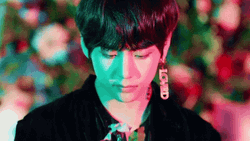 V Smelling A Flower GIF
