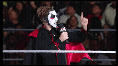 Vampire Man Holding Microphone GIF