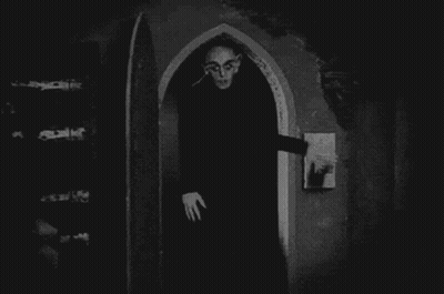 Vampire Standing In Archway GIF