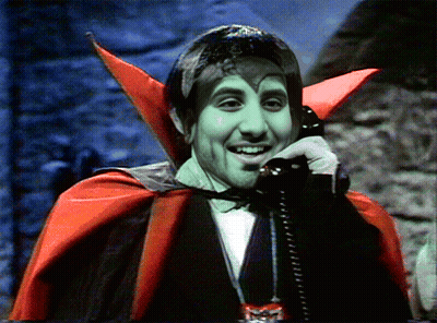 Vampire Talking On Telephone GIF