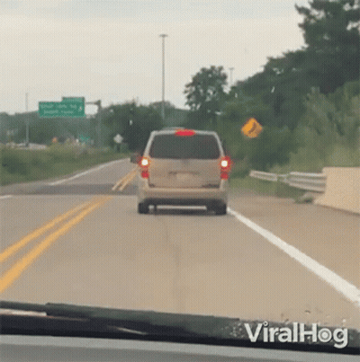 Van Driving Down Highway Next To I'm Sorry Sign GIF