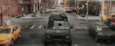 Van With Roof Rack Driving City Street GIF