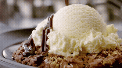 Vanilla Ice Cream Scoop On Brownie With Chocolate Sauce GIF