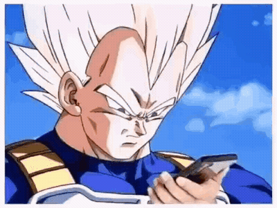 Vegeta From Dragon Ball Z Is Holding A Cell Phone In His Hand . GIF