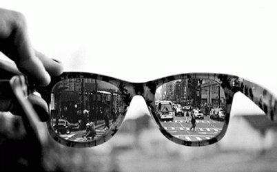 Vibrant City Life Reflected In Sunglasses GIF