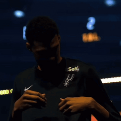 Victor Wembanyama Showing Off San Antonio Spurs Logo GIF