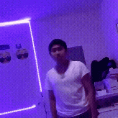Video Game Character Lying On Desk With Lamp GIF