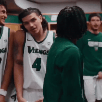 Vikings Basketball Players Talking In Locker Room GIF