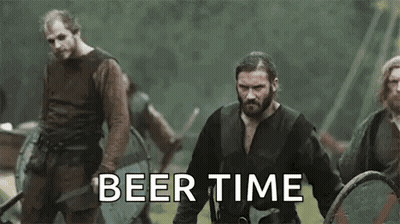 Vikings Standing In Field With Shields And Swords GIF