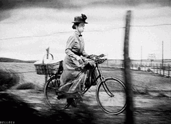 Vintage Bike Riding Lady Almira Gulch GIF
