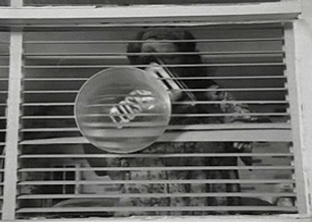 Vintage Lady Placing Closed Sign GIF