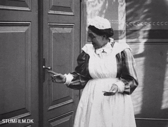 Vintage Peeping Tom Maid Peering Through Keyhole GIF