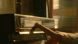 Vintage Pushing Vhs Tape To VCR  GIF