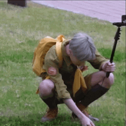 Vlogger Man Picking Grass GIF