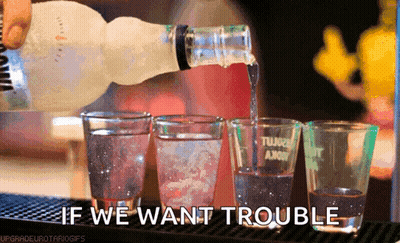 Vodka Bottle Pouring Into Shot Glasses GIF