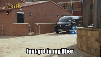 Volkswagen Van In Front Of Brick Building GIF
