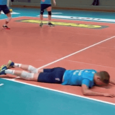 Volleyball Player Lying On Court With Legs Crossed GIF