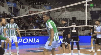 Volleyball Players In Front Of Ponia Sign GIF