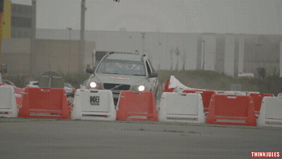 Volvo Car With Del Arte Driving Down A Road GIF