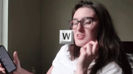 W Key Woman Holding Phone GIF