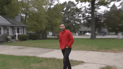 Walking Guy Giving A Smile GIF