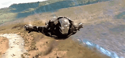 War Machine Flying Above Enemies GIF