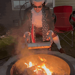 Warming Up With Firewood Outside GIF