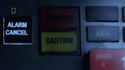 Warning Sign Next To Alarm Cancel Button GIF