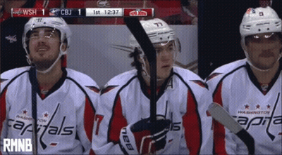 Washington Capitals Hockey Players On Bench Watching Game GIF