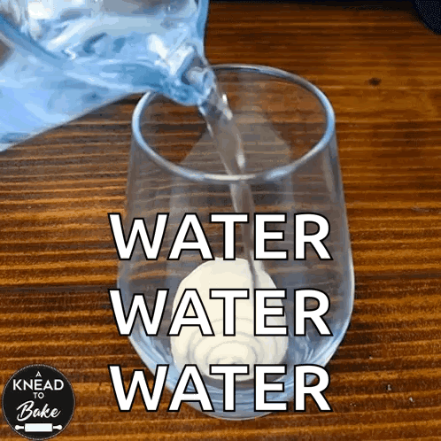Water Is Being Poured Into A Glass With The Words Water Water Water On It GIF