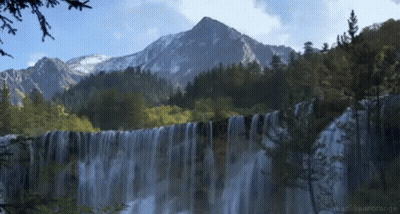 Waterfall In Forest With Mountain And Readthearange GIF