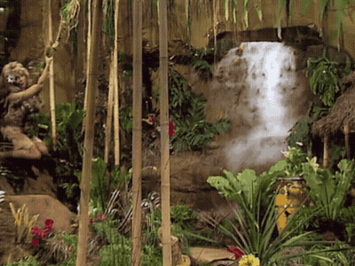 Waterfall Surrounded By Lush Green Jungle GIF