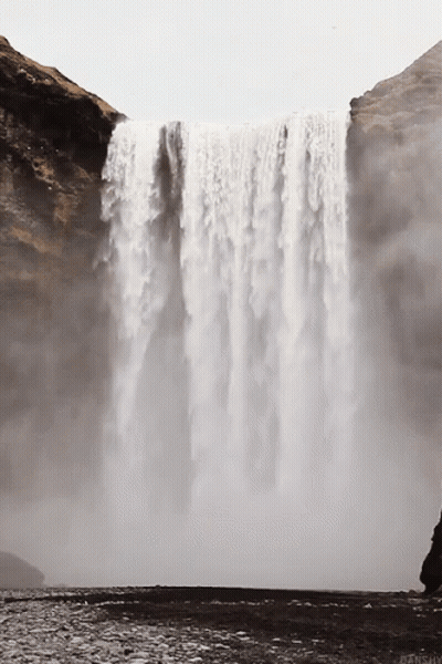 Waterfall Surrounded By Rocks And Cliff GIF