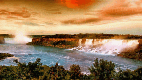 Waterfall Surrounded By Trees And Clouds GIF