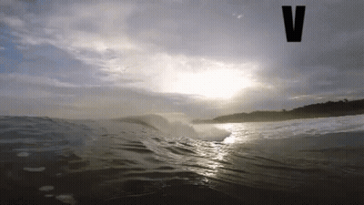 Wave Breaking On Beach With V GIF