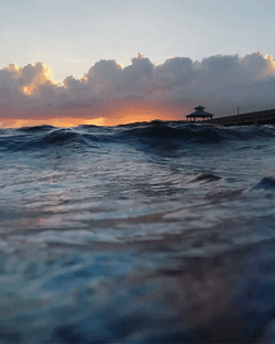 Waves And Sunrise Overlooking GIF