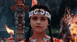 Wednesday Addams Creepy Holding A Match GIF