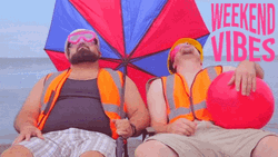 Weekend Vibes Men Relaxing On Beach GIF