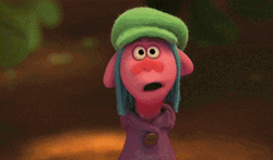 Weird Looking Troll Giving Birthday Cake GIF