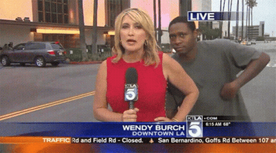 Wendy Burch Reporting Downtown LA Man Looks On GIF