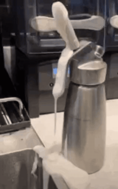 Whipped Cream Poured From Steel Container GIF