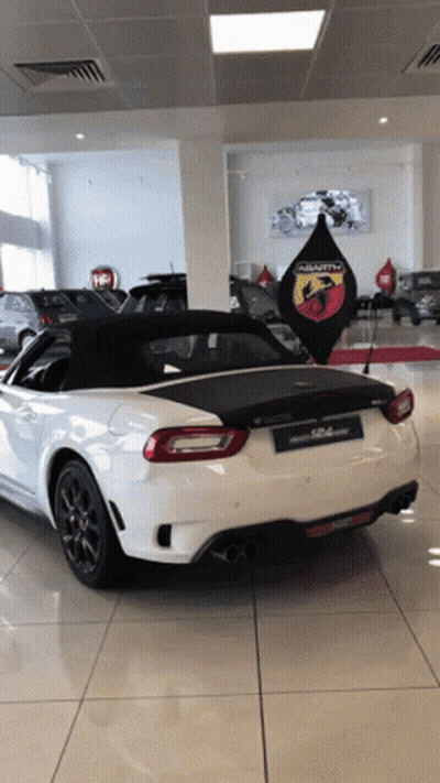 White Abarth In Car Showroom GIF