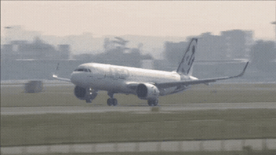 White Airplane With A320 On Tail GIF