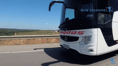 White And Black Bus With Odos On Front GIF
