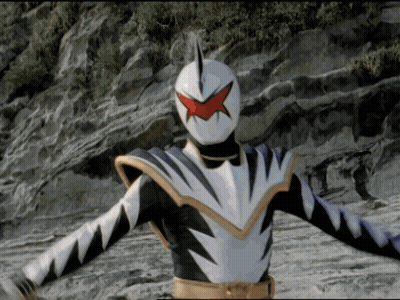 White And Black Superhero With Red Star On Face GIF