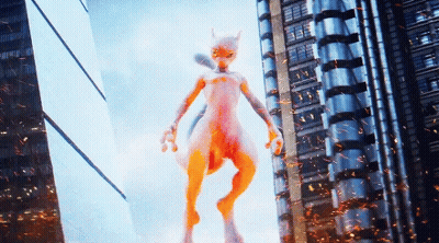 White And Orange Monster Standing In Front Of Building GIF