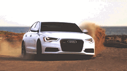 White Audi On Dusty Road