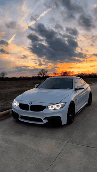 White BMW Parked At Sunset GIF