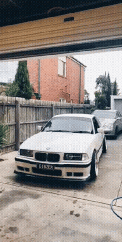 White BMW With License Plate Dibzer In Garage GIF